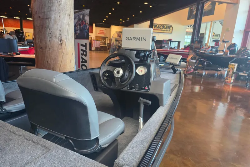 Slide: The Image of 2026 Tracker Bass Tracker Classic XL boat interior with Garmin navigation system. - 3