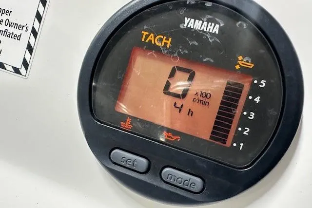 Slide: The Image of Yamaha tachometer displaying 0 RPM and 4 hours on AB Inflatables Mares 11 VSX, 2022 model. - 8