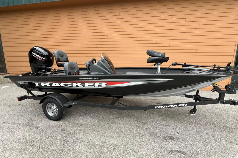 The Image of 2026 Tracker Pro Team 175 Crappie Edition boat on trailer, parked outdoors. - 0