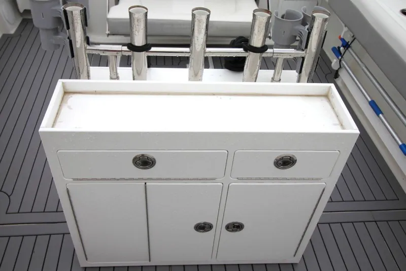 Slide: The Image of 2023 Parker 2320 Sport Cabin fishing rod holders and storage on deck. - 15