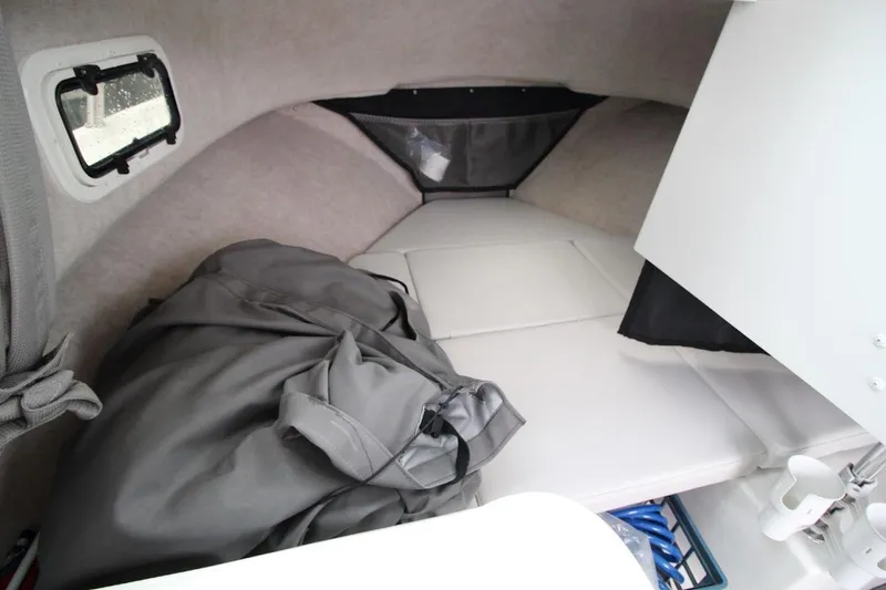 Slide: The Image of 2023 Parker 2320 Sport Cabin interior with cozy sleeping area and window. - 21