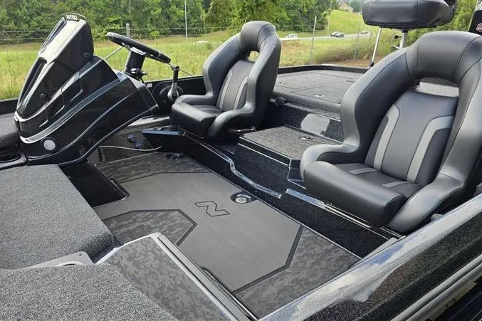 Slide: The Image of 2026 Nitro Z21 XL boat interior with sleek black seating and modern dashboard design. - 10