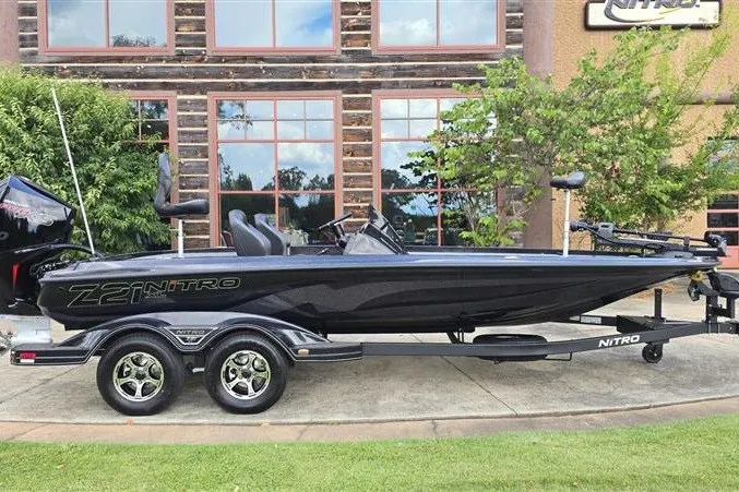 Slide: The Image of 2026 Nitro Z21 XL boat parked outdoors, showcasing sleek design and modern features. - 4