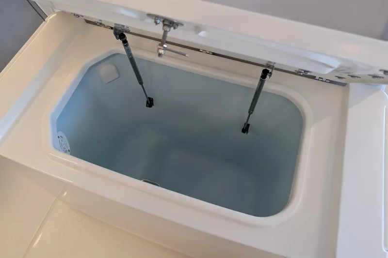 Slide: The Image of Livewell compartment in 2026 Mako 226 Center Console boat. - 13