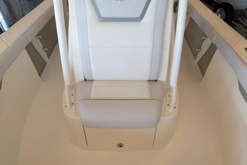 Slide: The Image of 2026 Mako 226 Center Console boat interior with cushioned seating and storage compartments. - 11