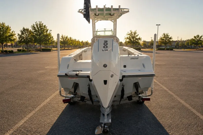 Slide: The Image of 2026 Mako 226 Center Console boat with 300 V8 engine in a parking lot. - 9