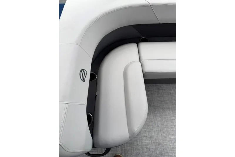 Slide: The Image of 2026 Sun Tracker Party Barge 18 DLX interior seating with cup holders and sleek design. - 16