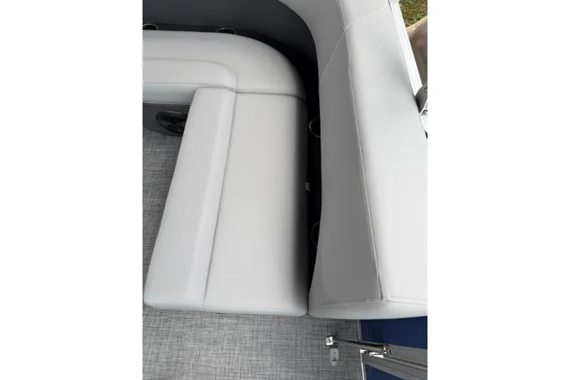 Slide: The Image of 2026 Sun Tracker Party Barge 18 DLX, featuring sleek white seating and modern design. - 12