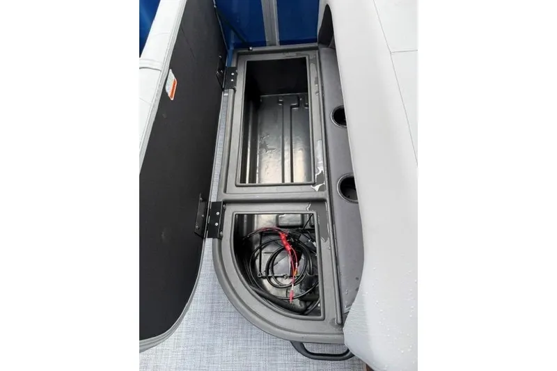 Slide: The Image of Storage compartment of 2026 Sun Tracker Party Barge 18 DLX with wiring visible. - 14