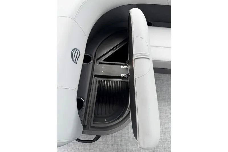 Slide: The Image of 2026 Sun Tracker Party Barge 18 DLX storage compartment with open seat revealing interior space. - 17