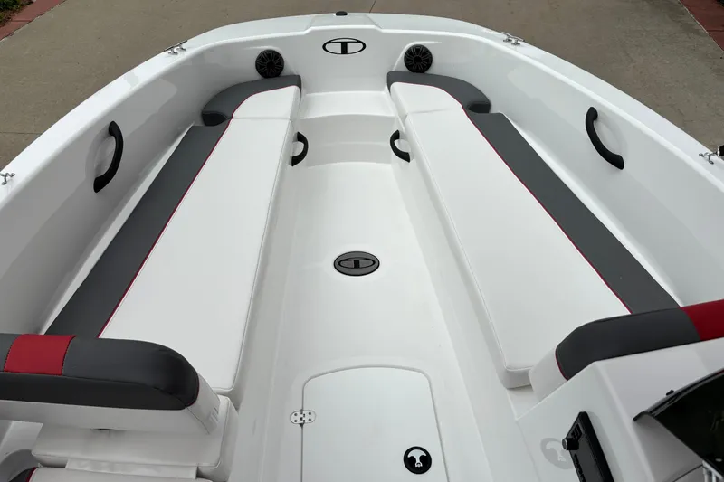 Slide: The Image of 2026 Tahoe T18 boat interior with white and gray seating, red accents, and modern design. - 3