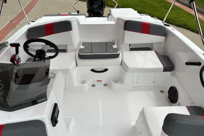 Slide: The Image of 2026 Tahoe T18 boat interior with modern seating and steering wheel design. - 4