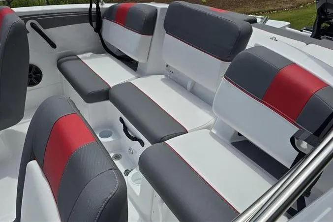 Slide: The Image of 2026 Tahoe T21 boat interior with gray and red cushioned seating. - 8