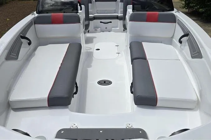 Slide: The Image of 2026 Tahoe T21 boat interior with gray and red seating, spacious layout. - 9