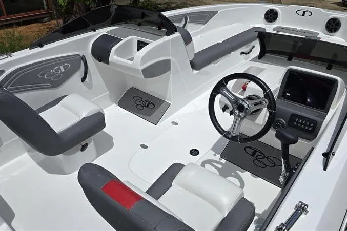 Slide: The Image of 2026 Tahoe T21 boat interior with modern steering, seating, and dashboard design. - 11