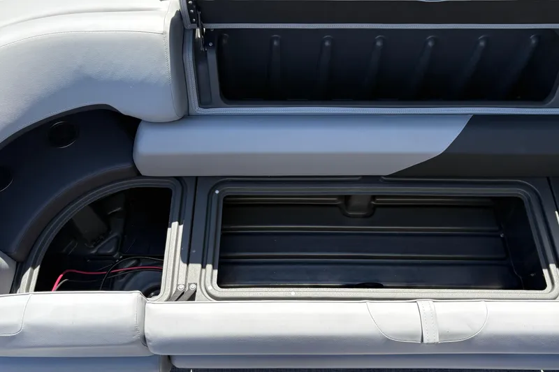 Slide: The Image of Storage compartment of 2026 Sun Tracker SportFish 20 DLX boat, showcasing spacious interior design. - 20