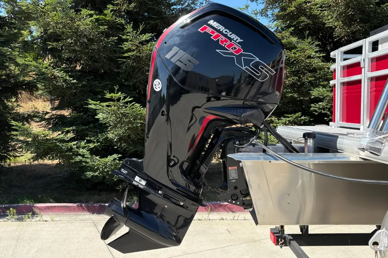 Slide: The Image of Mercury Pro XS outboard motor on 2026 Sun Tracker SportFish 20 DLX boat, outdoors. - 10