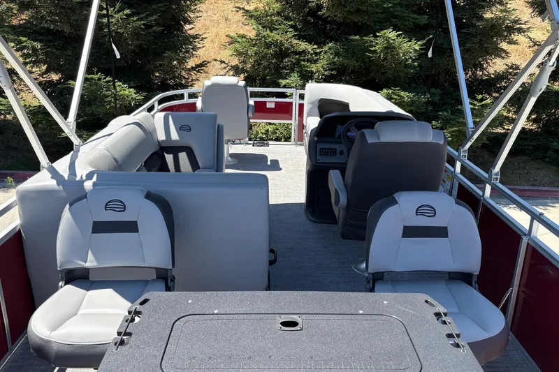 Slide: The Image of Interior view of 2026 Sun Tracker SportFish 20 DLX pontoon boat with seating and steering console. - 12