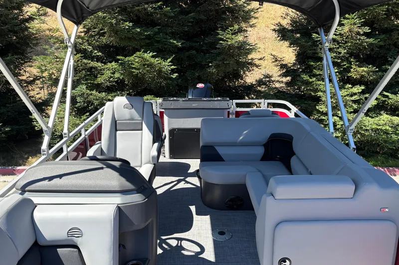 Slide: The Image of 2026 Sun Tracker SportFish 20 DLX pontoon boat with spacious seating and canopy. - 34