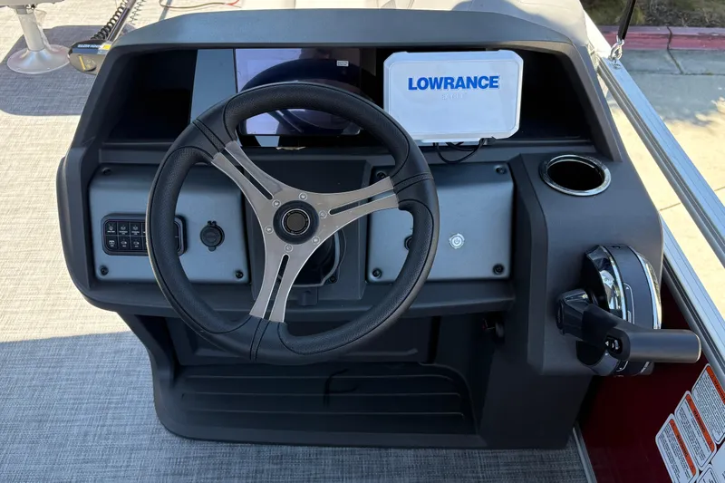 Slide: The Image of Steering console of 2026 Sun Tracker SportFish 20 DLX with Lowrance electronics. - 17