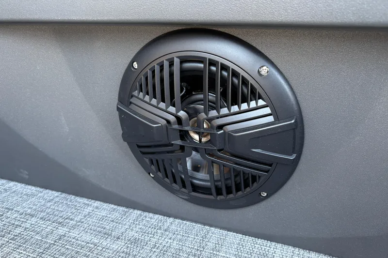 Slide: The Image of Close-up of a speaker on a 2026 Sun Tracker SportFish 20 DLX boat. - 26