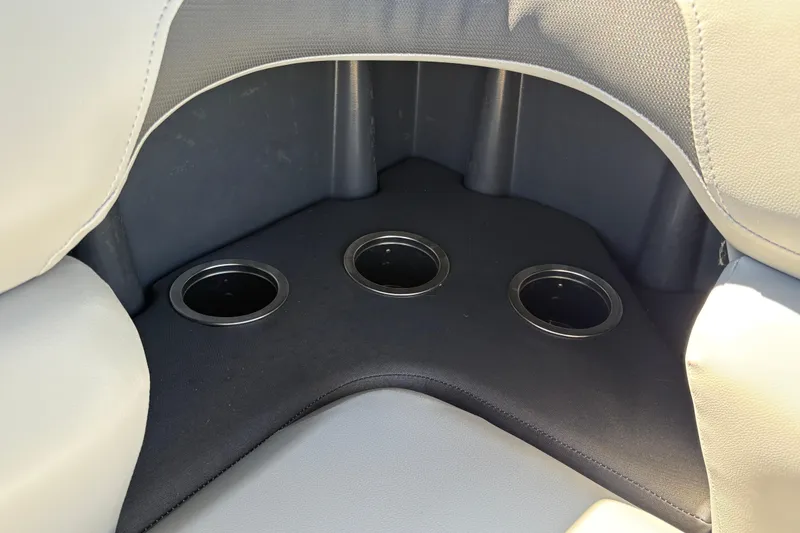 Slide: The Image of Three cup holders in Sun Tracker SportFish 20 DLX boat, 2026 model. - 30