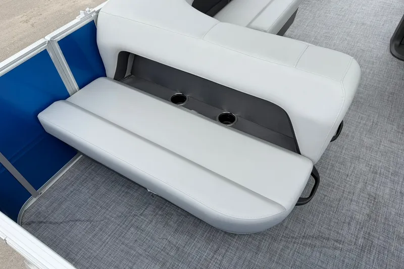 Slide: The Image of 2026 Sun Tracker Party Barge 18 DLX boat seating with cup holders and gray upholstery. - 15