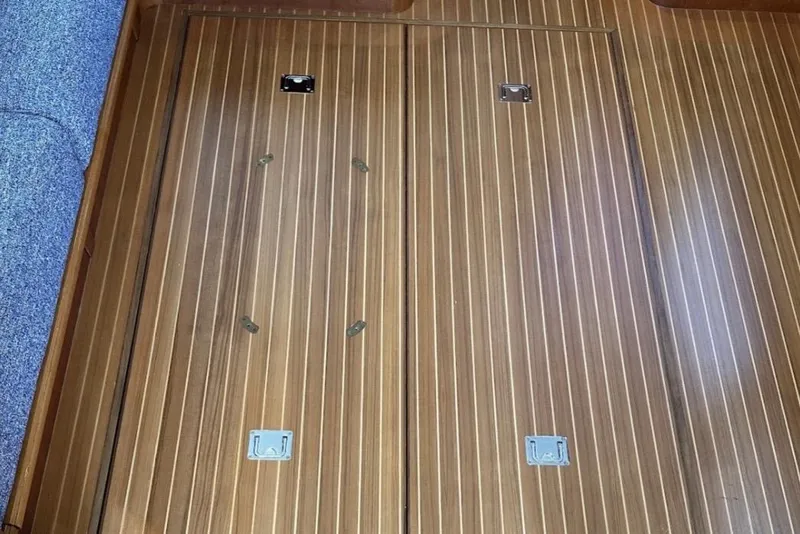 Slide: The Image of Wooden floorboards on a 2009 Grand Banks 47 Heritage CL yacht interior. - 12