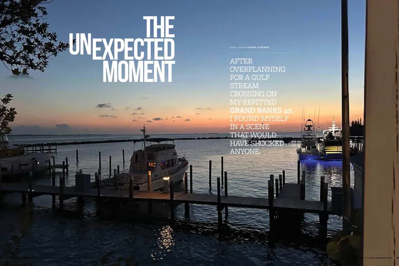 Slide: The Image of Sunset view of a 2009 Grand Banks 47 Heritage CL docked, with serene waters and vibrant sky. - 4