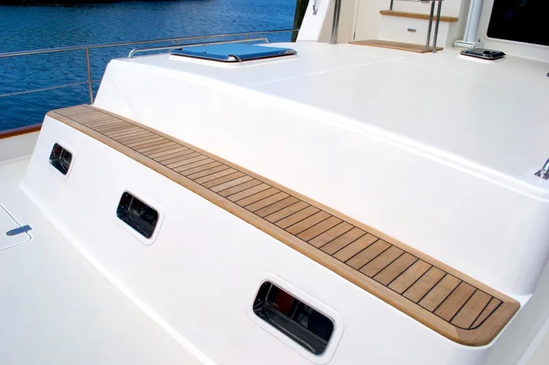 Slide: The Image of 2009 Grand Banks 47 Heritage CL yacht deck with teak accents and windows. - 6