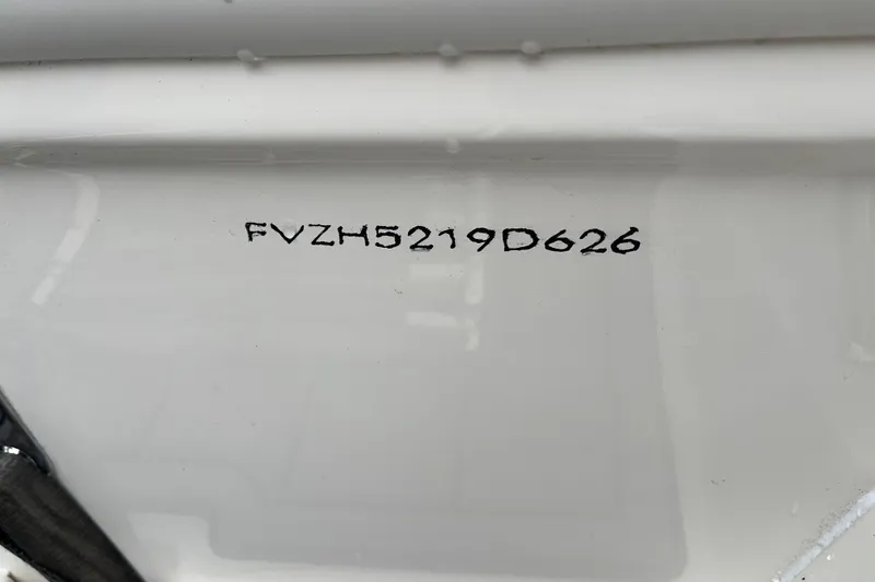 Slide: The Image of 2026 Pioneer 202 Islander boat hull identification number (HIN) on white surface. - 14