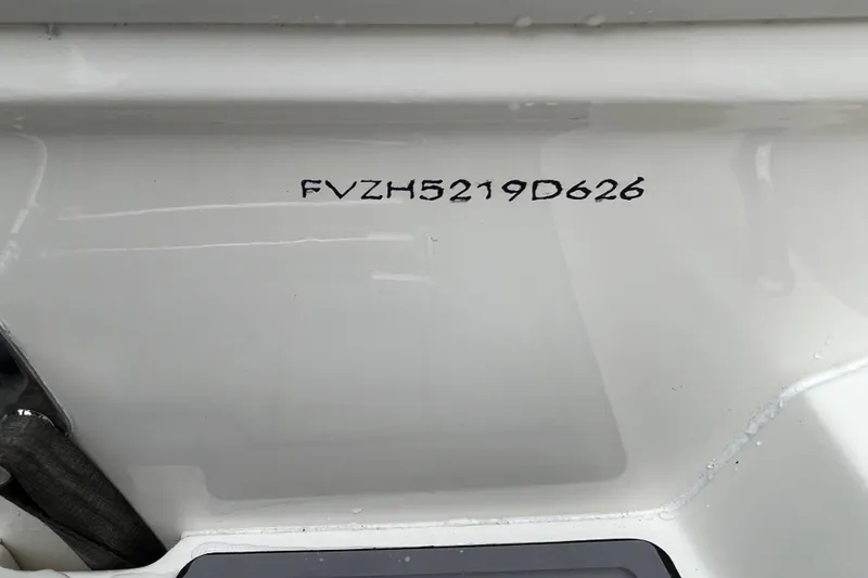 Slide: The Image of 2026 Pioneer 202 Islander boat hull identification number (HIN) on white surface. - 16