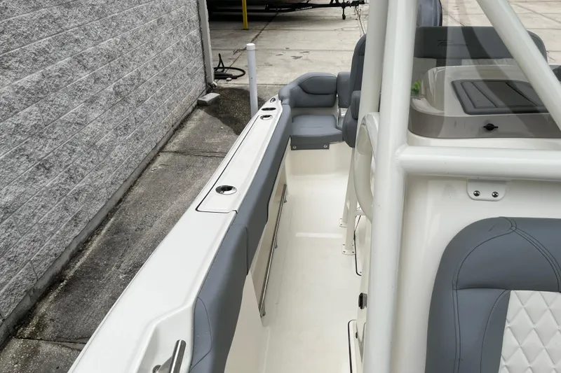 Slide: The Image of 2026 Pioneer 202 Islander boat interior with gray seating and sleek design. - 19