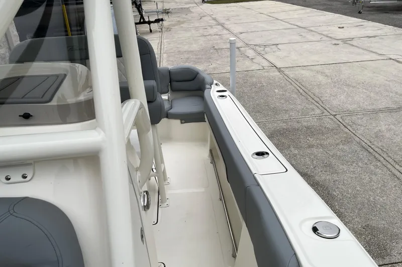 Slide: The Image of 2026 Pioneer 202 Islander boat interior with gray seating and white deck. - 20