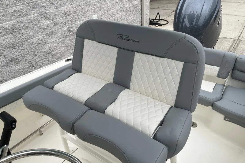 Slide: The Image of 2026 Pioneer 202 Islander boat seat with gray and white quilted upholstery. - 25