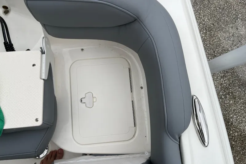 Slide: The Image of Interior seating of 2026 Pioneer 202 Islander boat with storage compartment. - 28