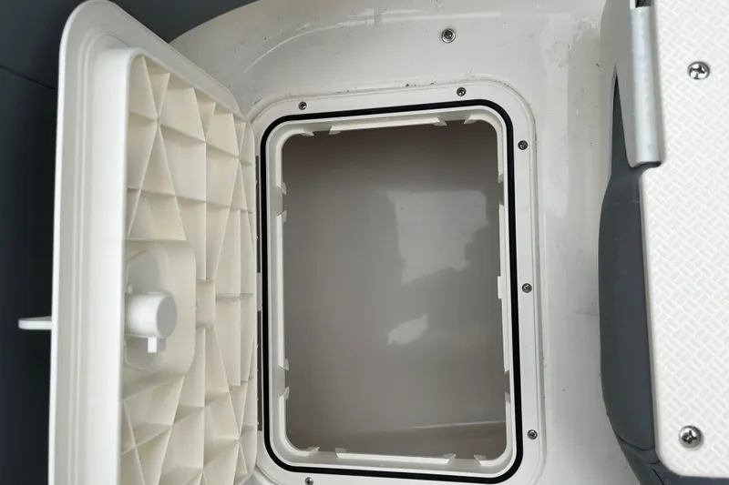 Slide: The Image of Open storage compartment on 2026 Pioneer 202 Islander boat, showcasing interior details. - 30