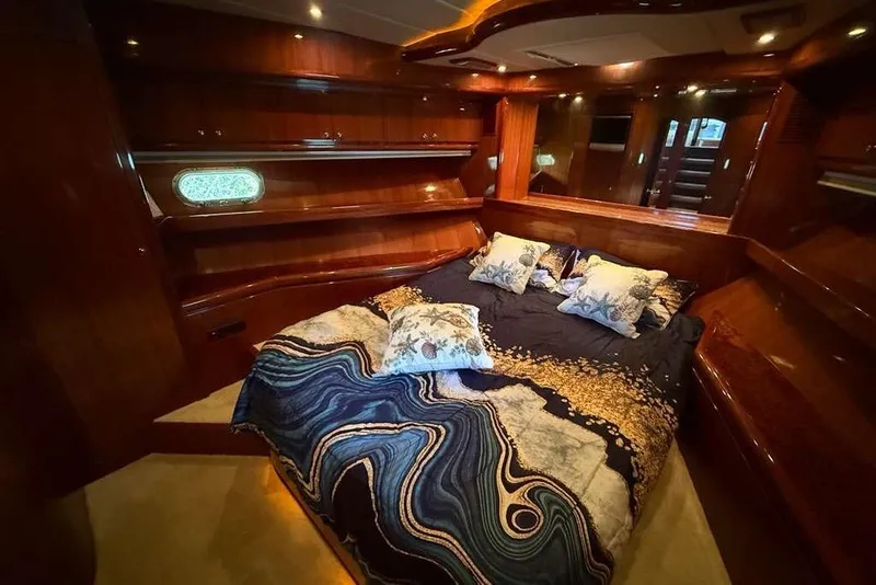 Slide: The Image of Luxurious bedroom in 2008 Hampton 60' Aft Cabin Motor Yacht with elegant wood finish. - 27