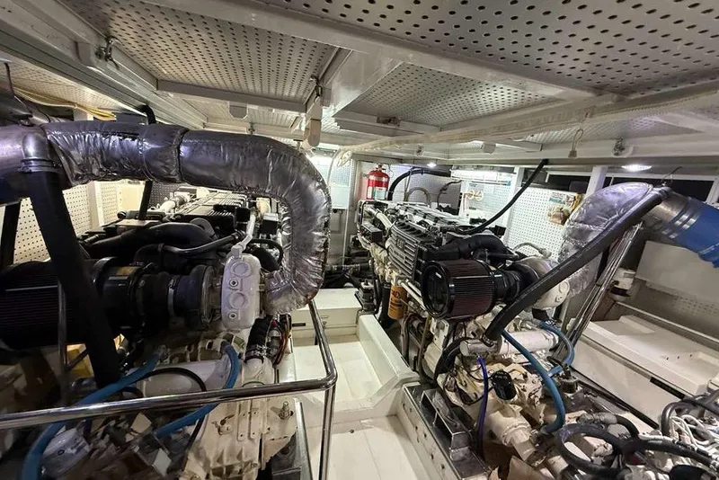 Slide: The Image of Engine room of a 2008 Hampton 60' Aft Cabin Motor Yacht, showcasing machinery and equipment. - 15
