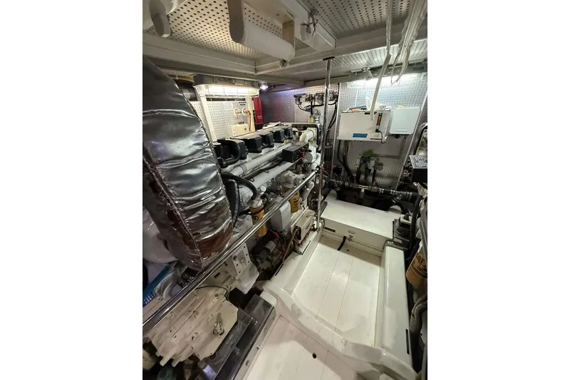 Slide: The Image of Engine room of a 2008 Hampton 60' Aft Cabin Yacht with complex machinery. - 16