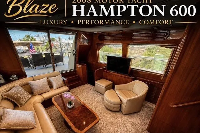 Slide: The Image of Luxurious interior of 2008 Hampton 60' Aft Cabin Motor Yacht, featuring elegant seating and wood finishes. - 7