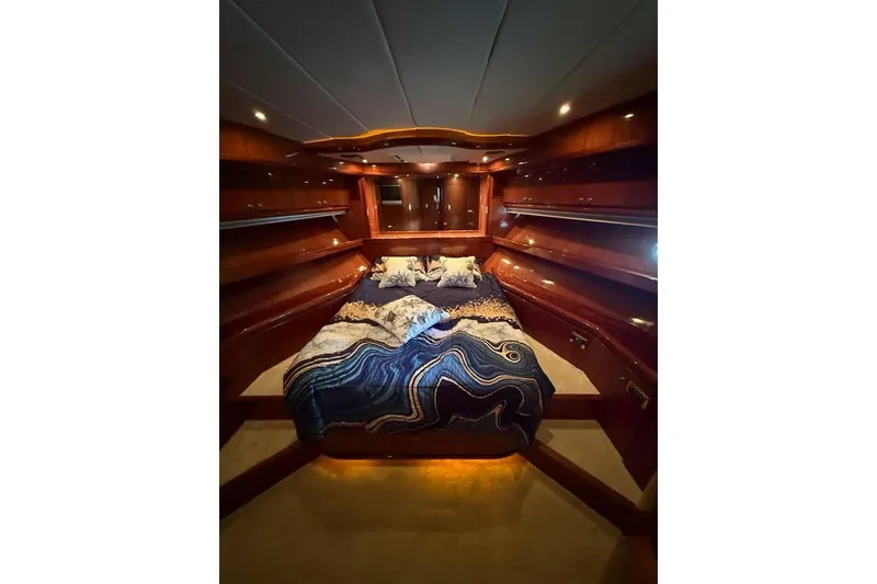 Slide: The Image of Luxurious cabin interior of 2008 Hampton 60' Aft Cabin Motor Yacht with elegant wood finish. - 26