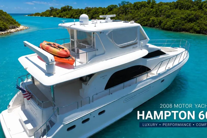 Slide: The Image of 2008 Hampton 60' Aft Cabin Motor Yacht cruising in turquoise waters. - 1
