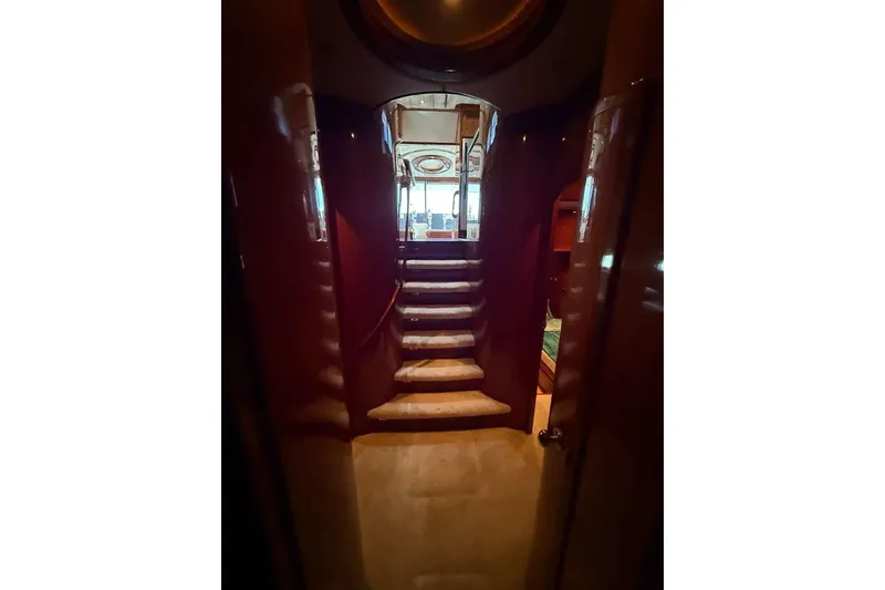 Slide: The Image of Interior view of 2008 Hampton 60' Aft Cabin Motor Yacht with elegant staircase. - 9