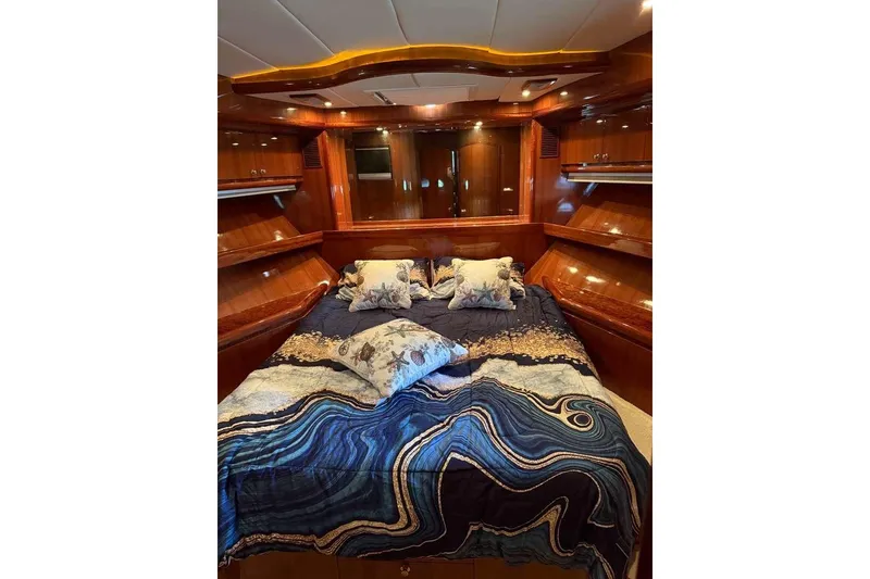 Slide: The Image of Luxurious bedroom in 2008 Hampton 60' Aft Cabin Motor Yacht with elegant wood finish. - 28