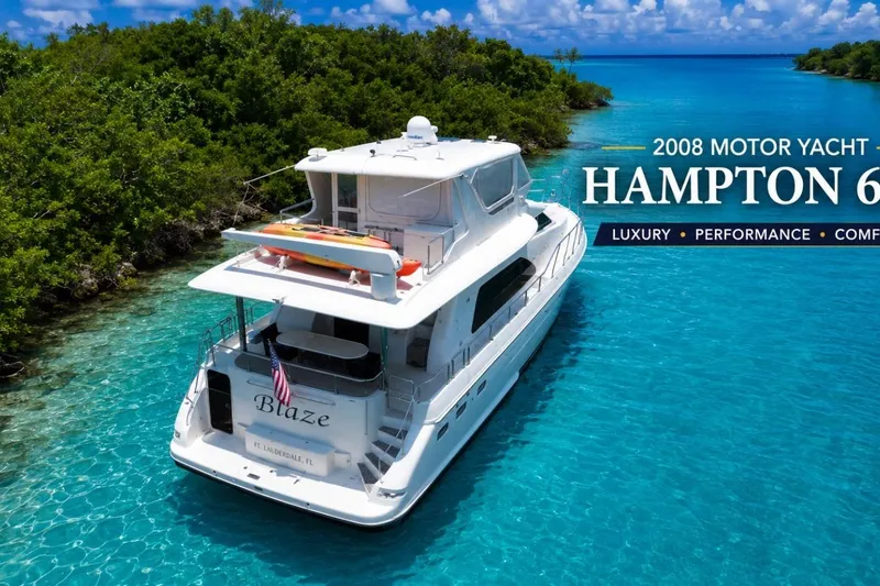 Slide: The Image of 2008 Hampton 60' Aft Cabin Motor Yacht cruising in clear turquoise waters. - 6