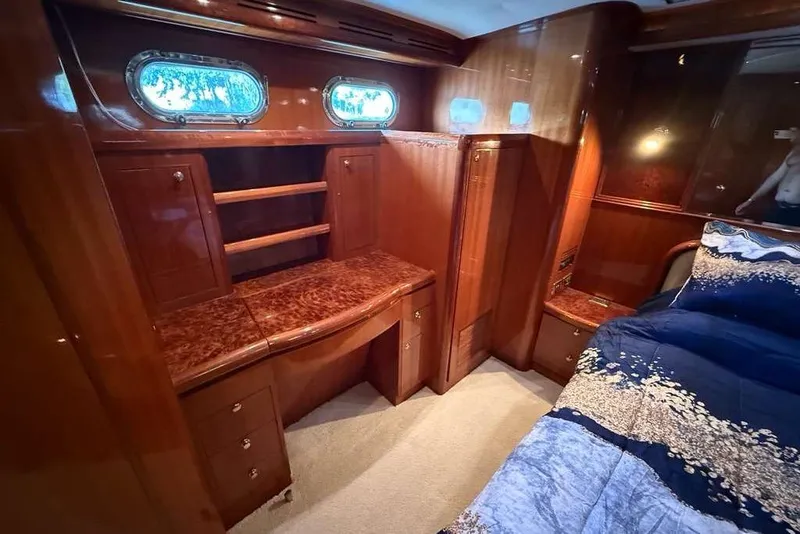 Slide: The Image of Luxurious wood-finished cabin interior of a 2008 Hampton 60' Aft Cabin Motor Yacht. - 23