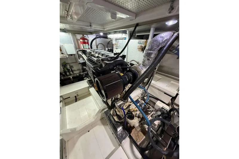 Slide: The Image of Engine room of 2008 Hampton 60' Aft Cabin Motor Yacht, showcasing detailed machinery and components. - 41