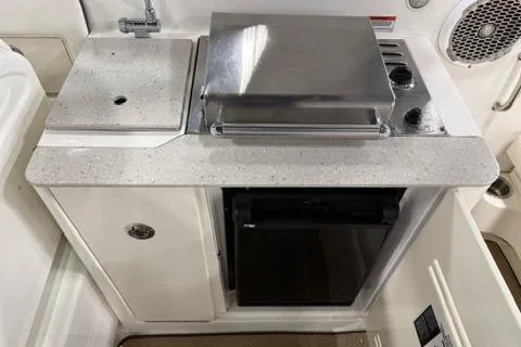 Slide: The Image of 2008 Sea Ray 300 Select EX boat kitchenette with sink, grill, and storage. - 11