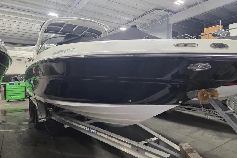 Slide: The Image of 2008 Sea Ray 300 Select EX boat on trailer in indoor storage facility. - 12